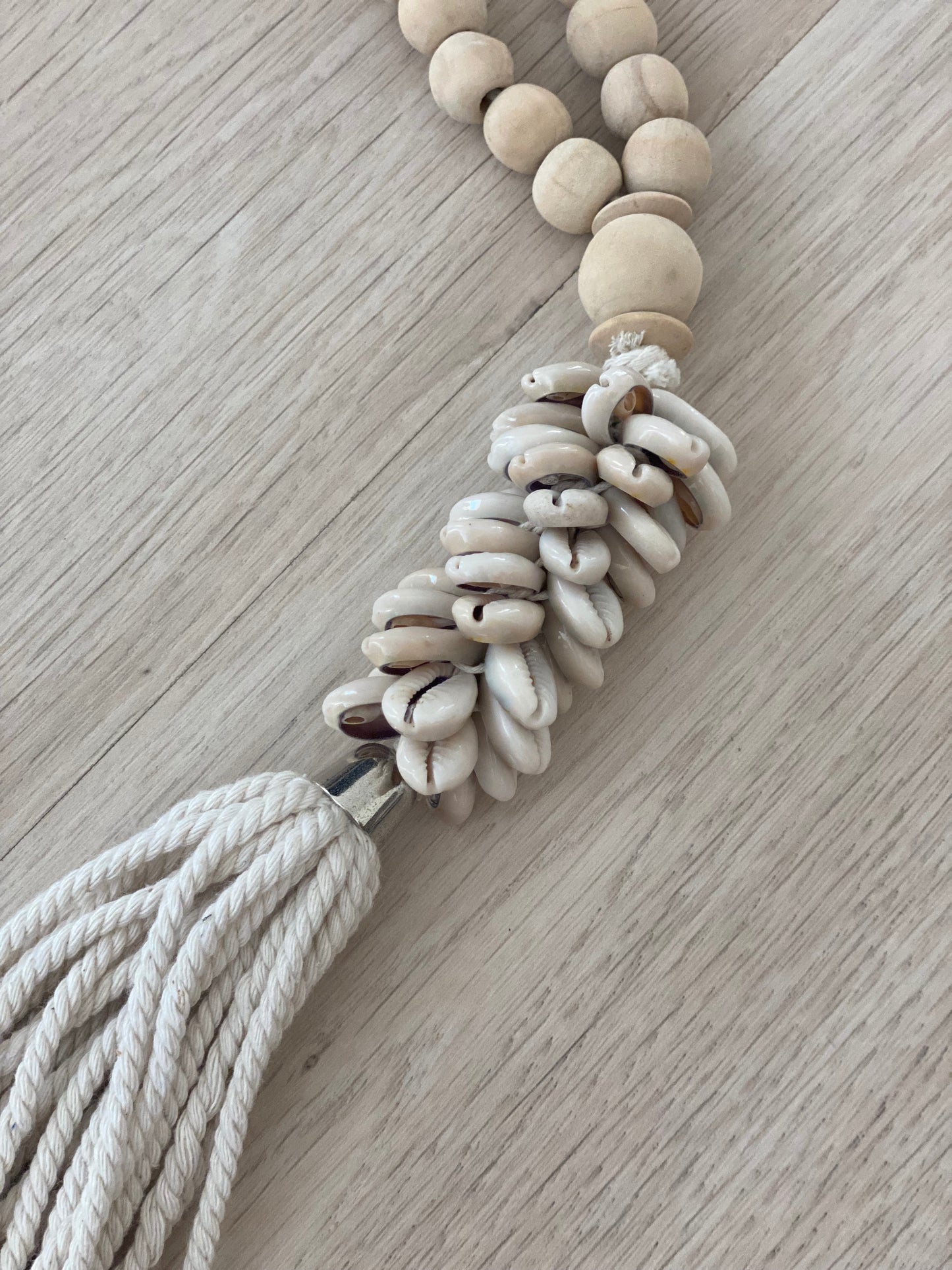 Wooden beads with cowrie shell