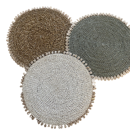 Rattan place mats with cowrie shells