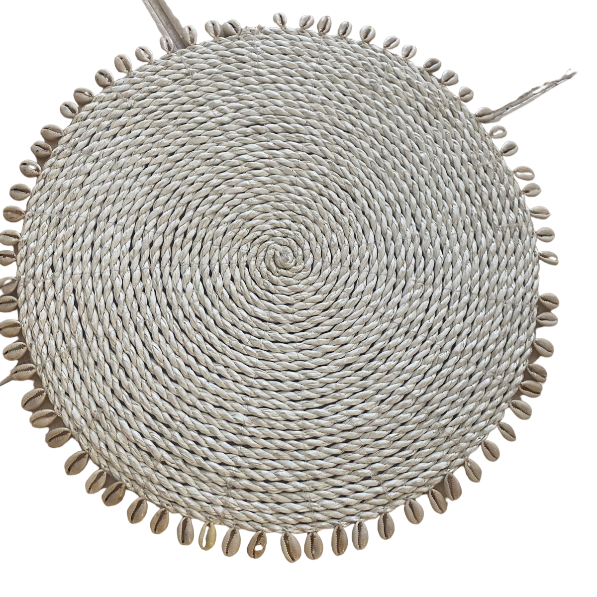 Rattan place mats with cowrie shells
