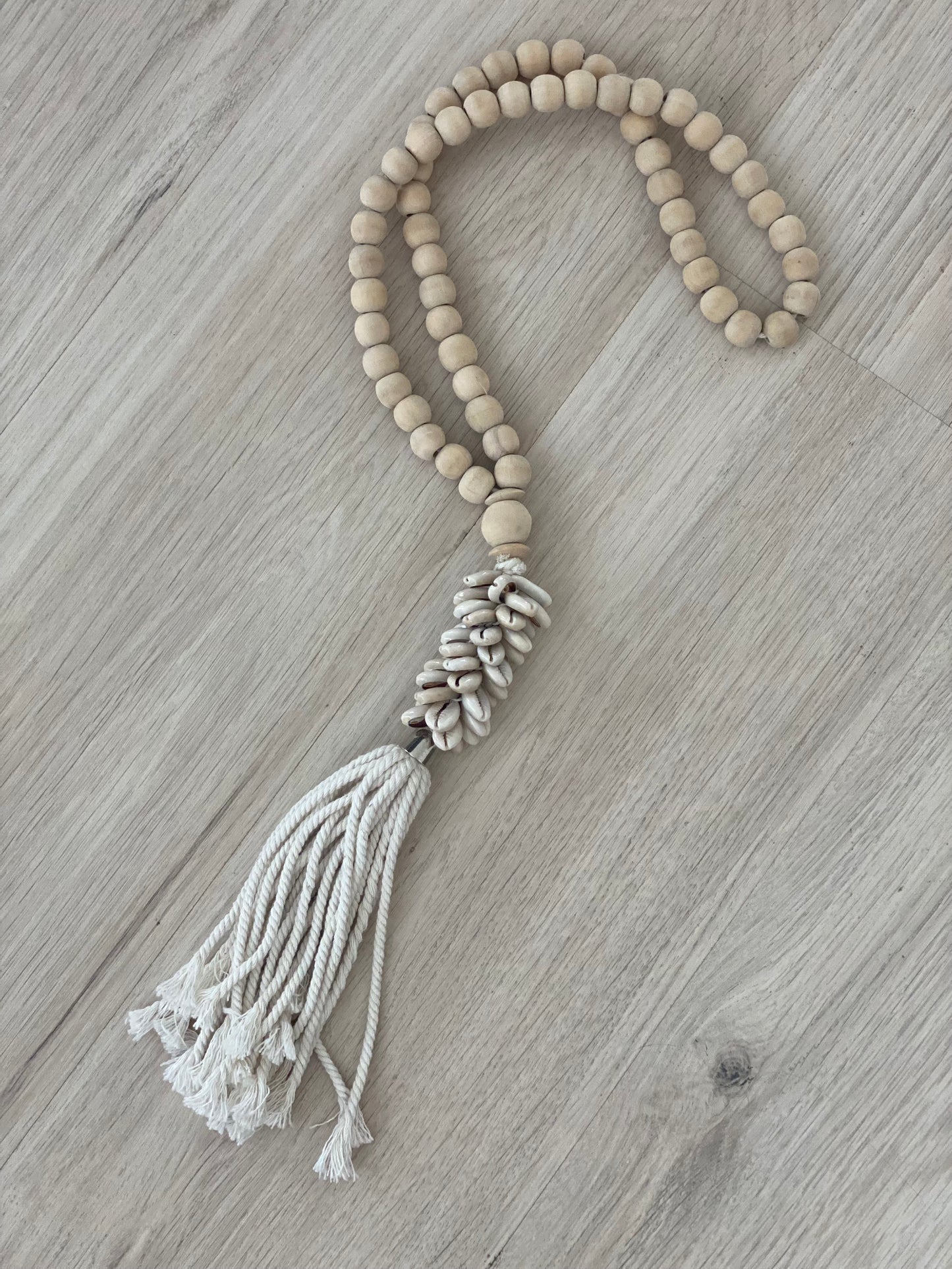 Wooden beads with cowrie shell